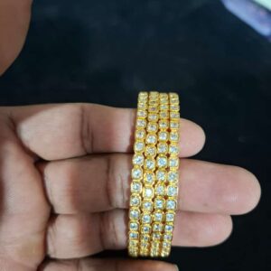 gold plated impon bangles with a.d,stones. code sgc90